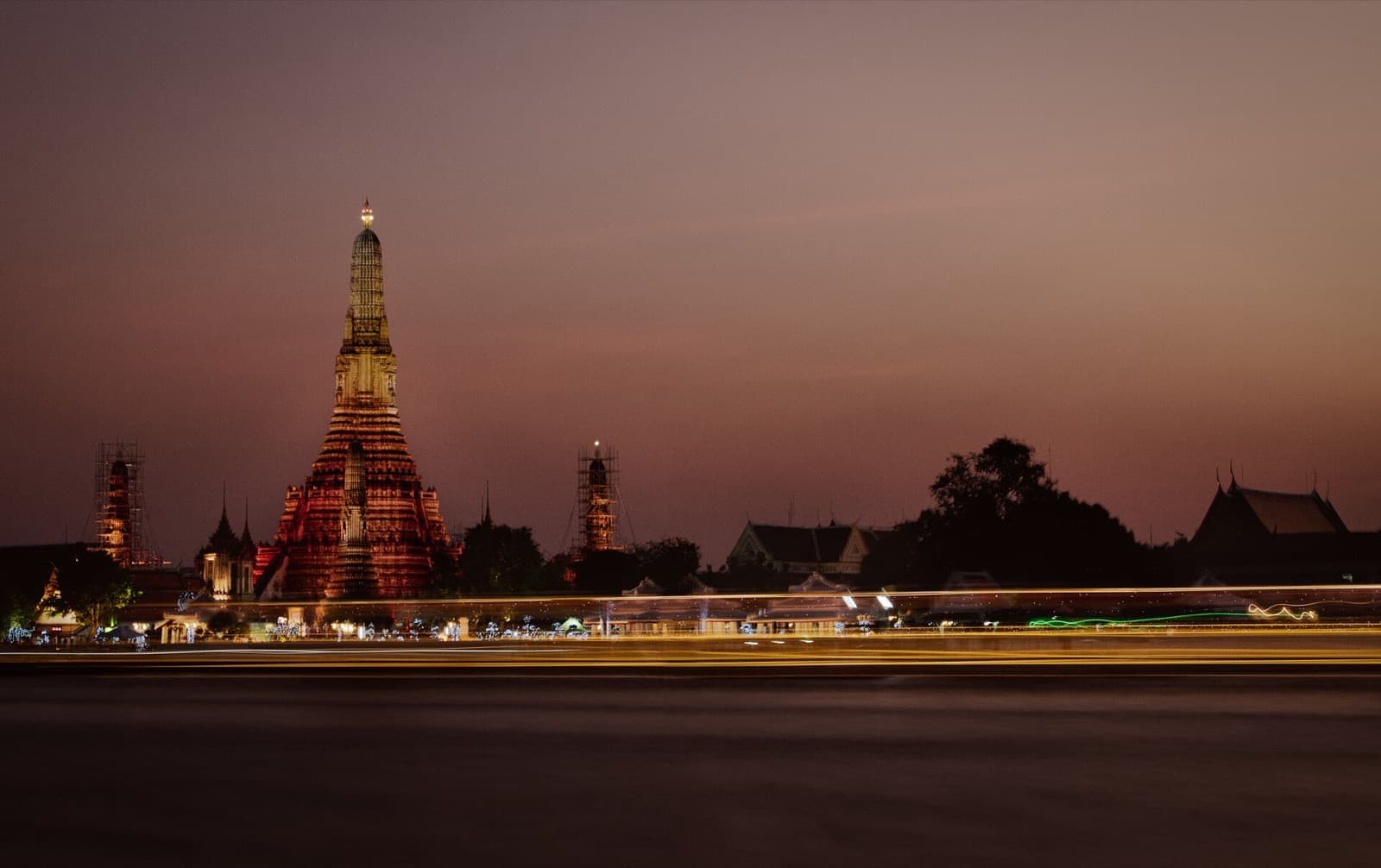 Wat Arun lit up across the Chao Phraya River in Bangkok