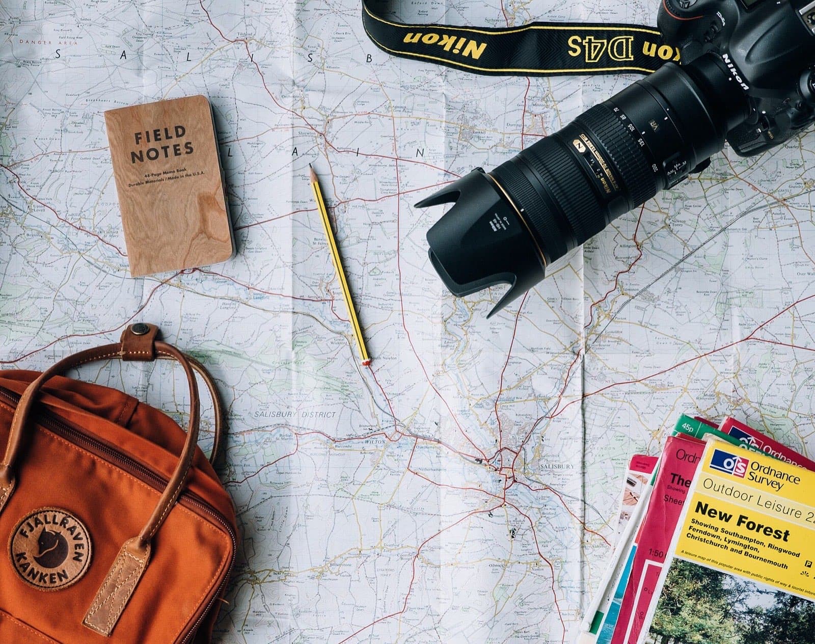 Travel planning laid out with a map and notebook