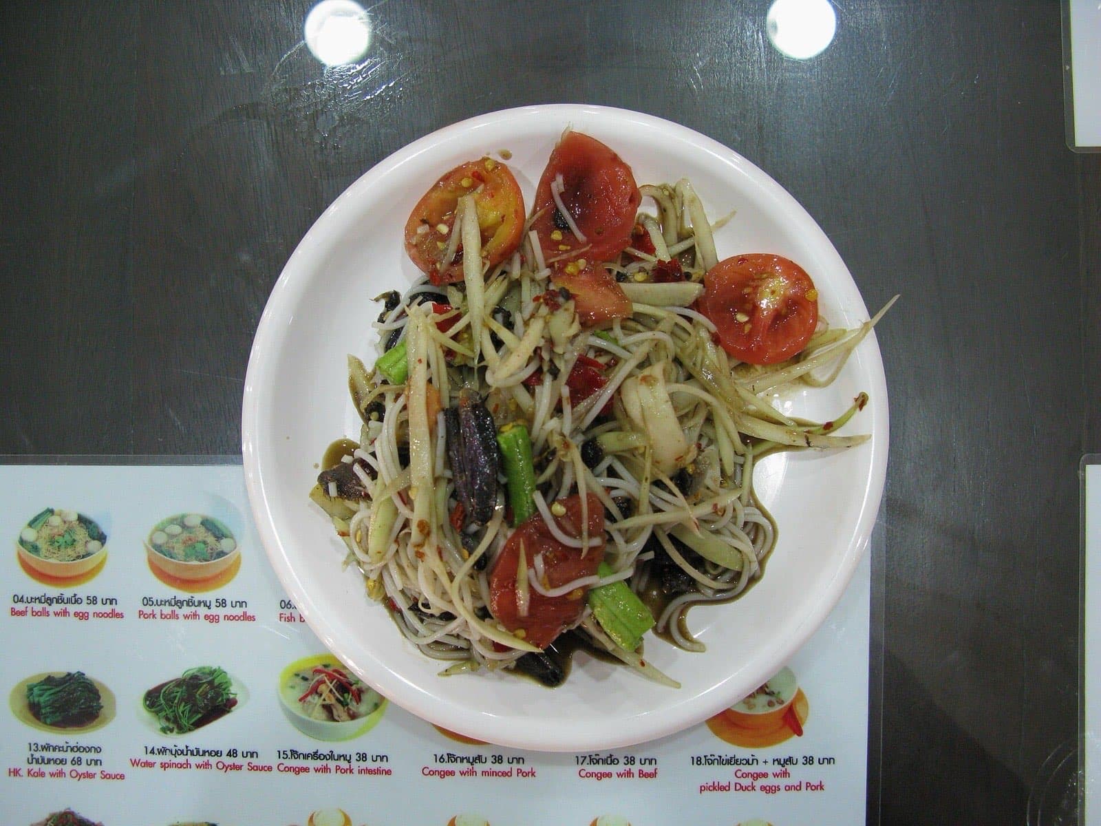 Som tam green papaya salad served at a Bangkok food stall